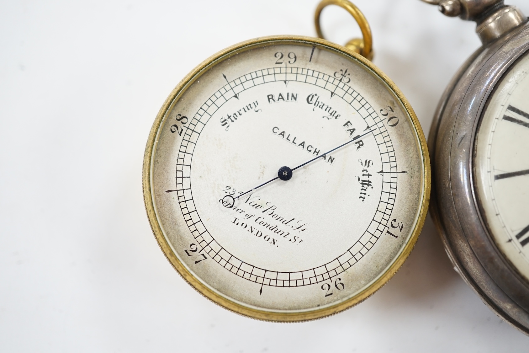 A Victorian silver pair cased keywind verge pocket watch, together with a Callaghan brass cased barometer in leather case. Condition - poor to fair